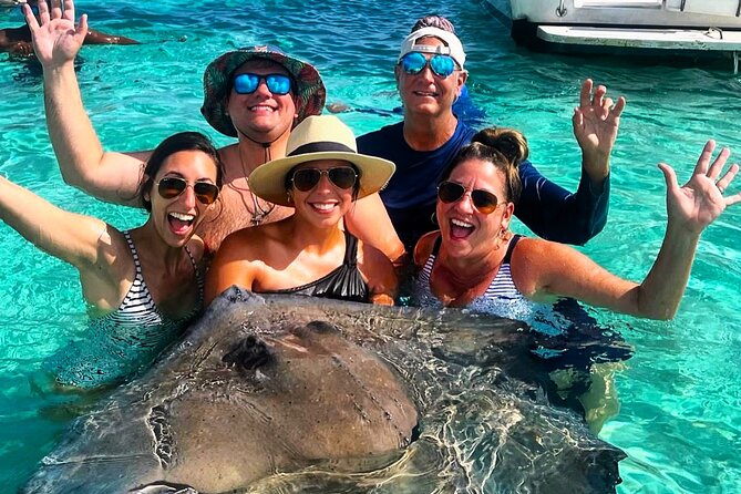 Private Charter 34ft Express Cruiser Stingay City Reef Snorkeling - Stingray City in waist-deep water